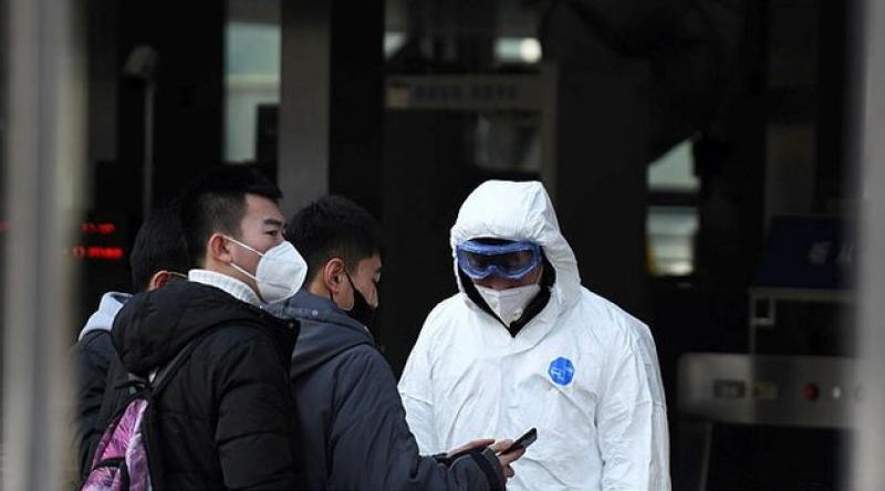 Çin'de virüs şüphesi taşıyanlar evlerinden yaka paça götürülüyorlar